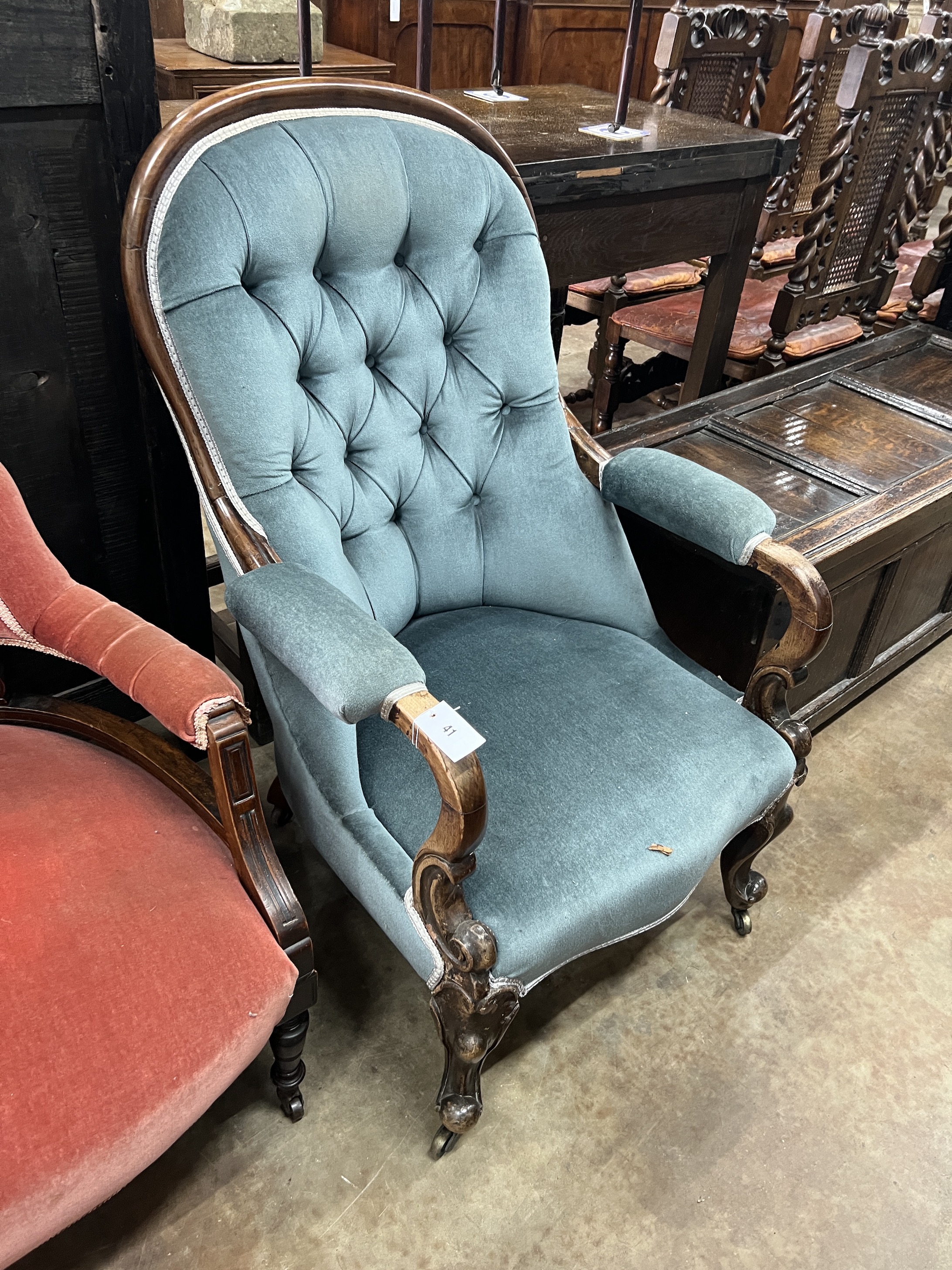 A pair of late Victorian tub shaped open armchairs, upholstered, one in red, the other in blue, width 68cm, depth 58cm, height 72cm
